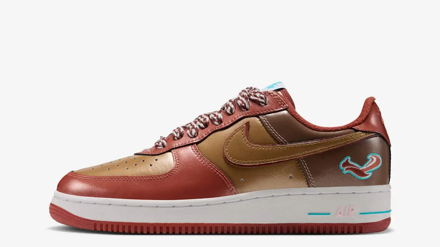 Side view of the j-hope x NIGO Air Force 1 in brown, gold and rust tones, with patterned laces and a squirrel graphic.