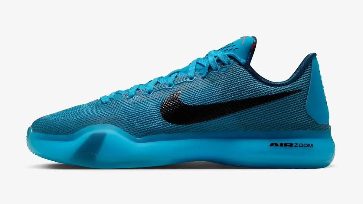 Kobe 10 Protro Blue Lagoon in blue lagoon with a black Swoosh and a translucent blue sole, side view on a light grey ground.