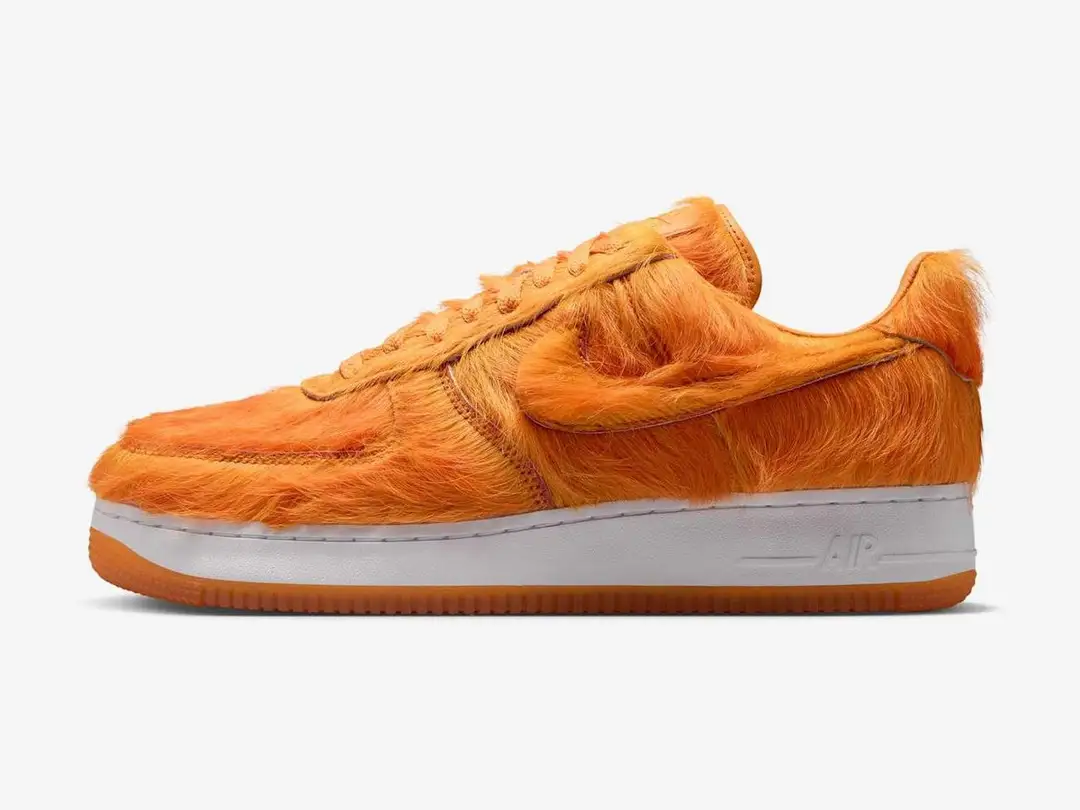 Nike Air Force 1 in campfire orange, white, sunset, side view